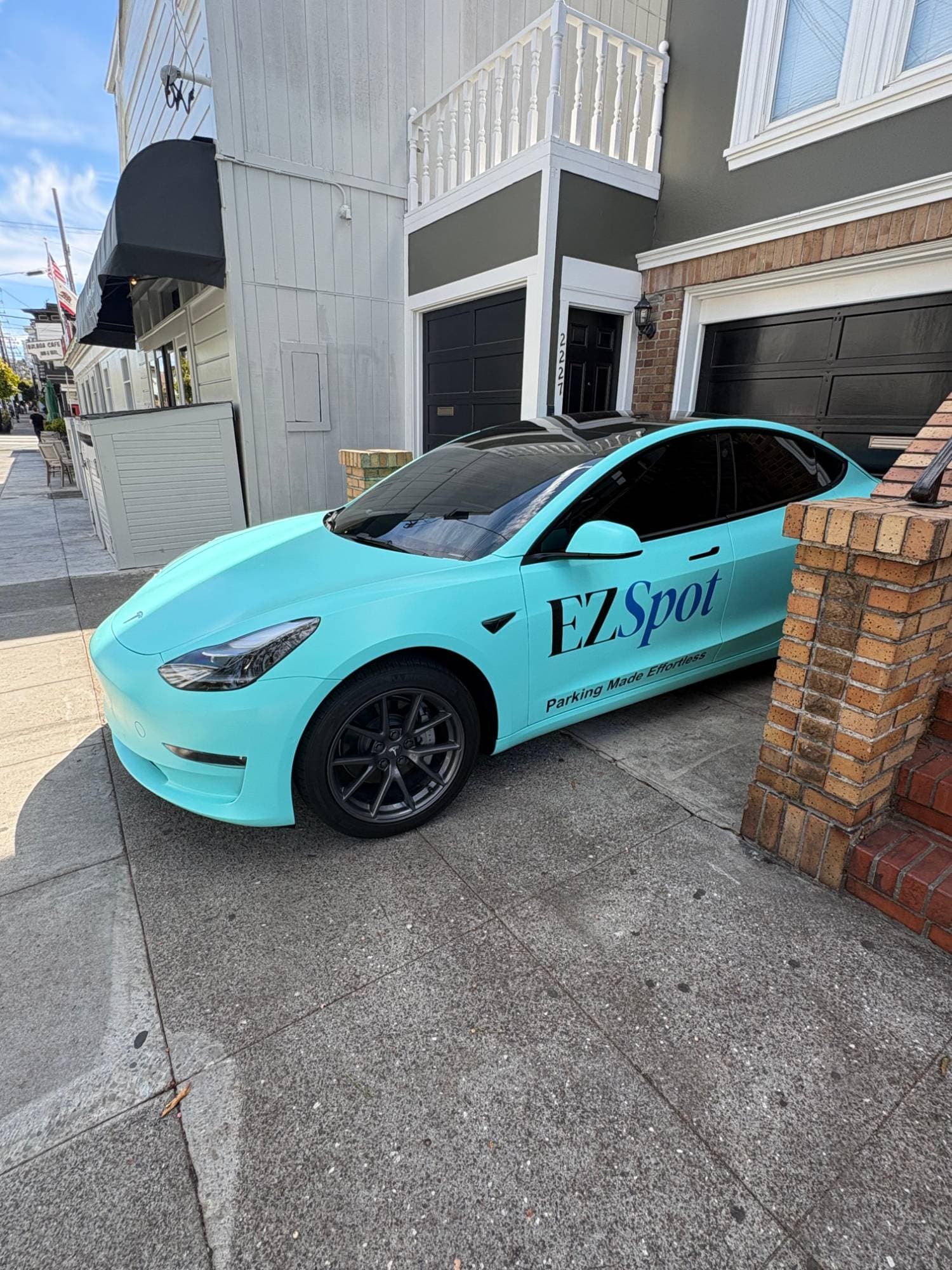 An EZSpot-wrapped car parked in a San Francisco driveway